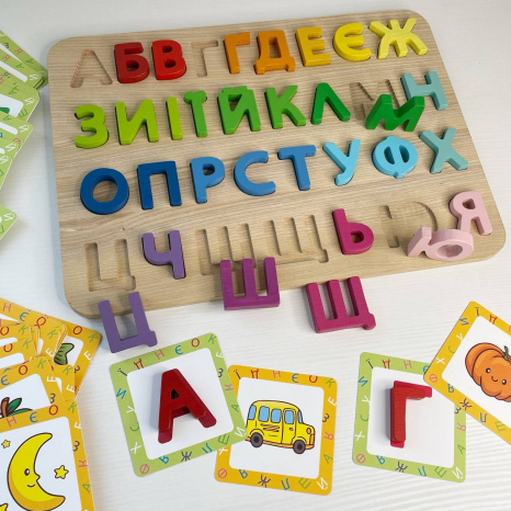 Дерев'яна гра-сортер з картками (рамка-вкладиш) Українська абетка Logosvit