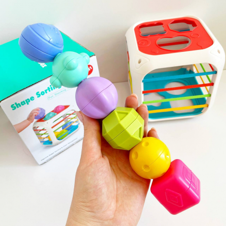 Розвиваючий сортер з резиночками та тактильними елеменами  грані з резинками, 6 фігур (брязкальця) 608-99