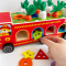 Дерев'яна багатофункціональна іграшка Пожежна машина (геометричний сортер, стукатка, грядка з морквинами), C 68271