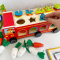 Дерев'яна багатофункціональна іграшка Пожежна машина (геометричний сортер, стукатка, грядка з морквинами), C 68271