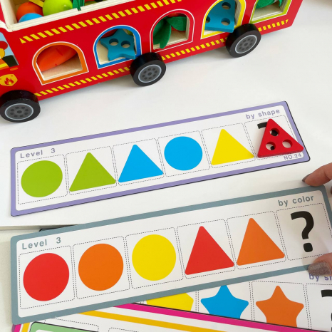 Дерев'яна багатофункціональна іграшка Пожежна машина (геометричний сортер, стукатка, грядка з морквинами), C 68271