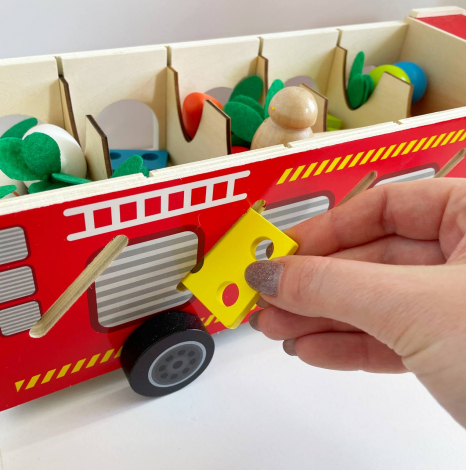 Дерев'яна багатофункціональна іграшка Пожежна машина (геометричний сортер, стукатка, грядка з морквинами), C 68271