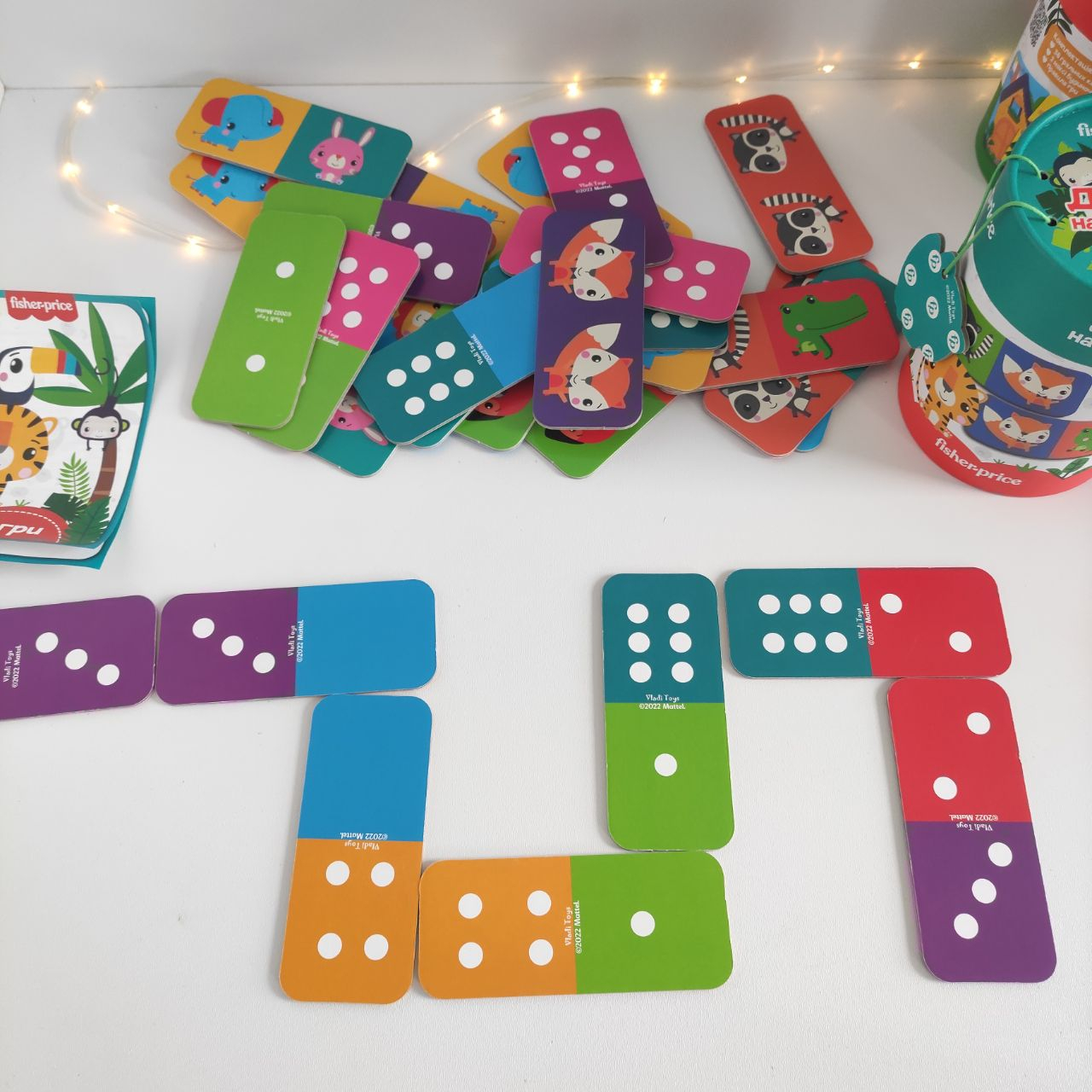 Настільна гра Fisher Price. Доміно двостороннє в тубусі VT2910-03 (укр)